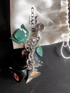 Coach Black Leather Floral Keychain Charm with Green Enamel Accents